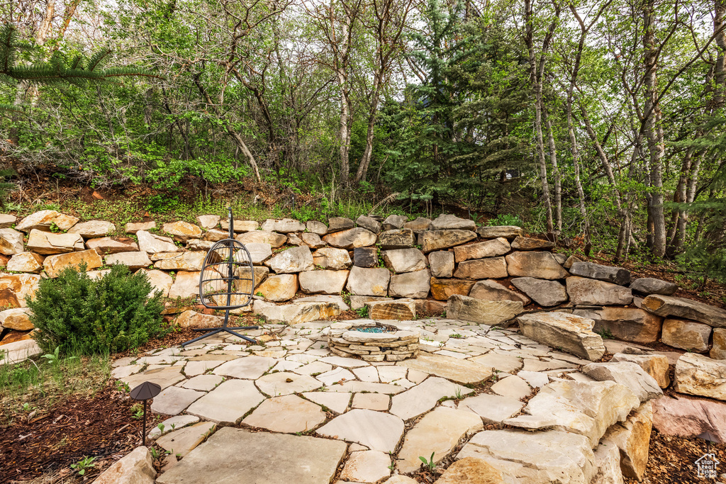 View of patio featuring an outdoor fire pit
