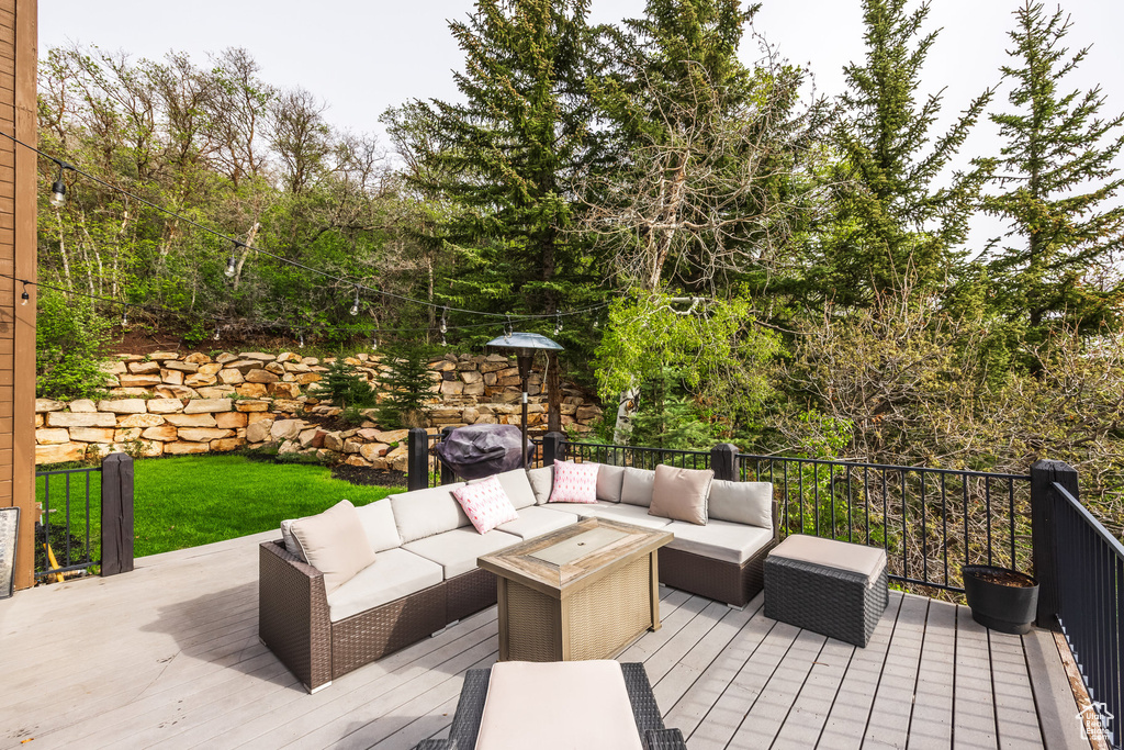 Deck with outdoor lounge area and area for grilling