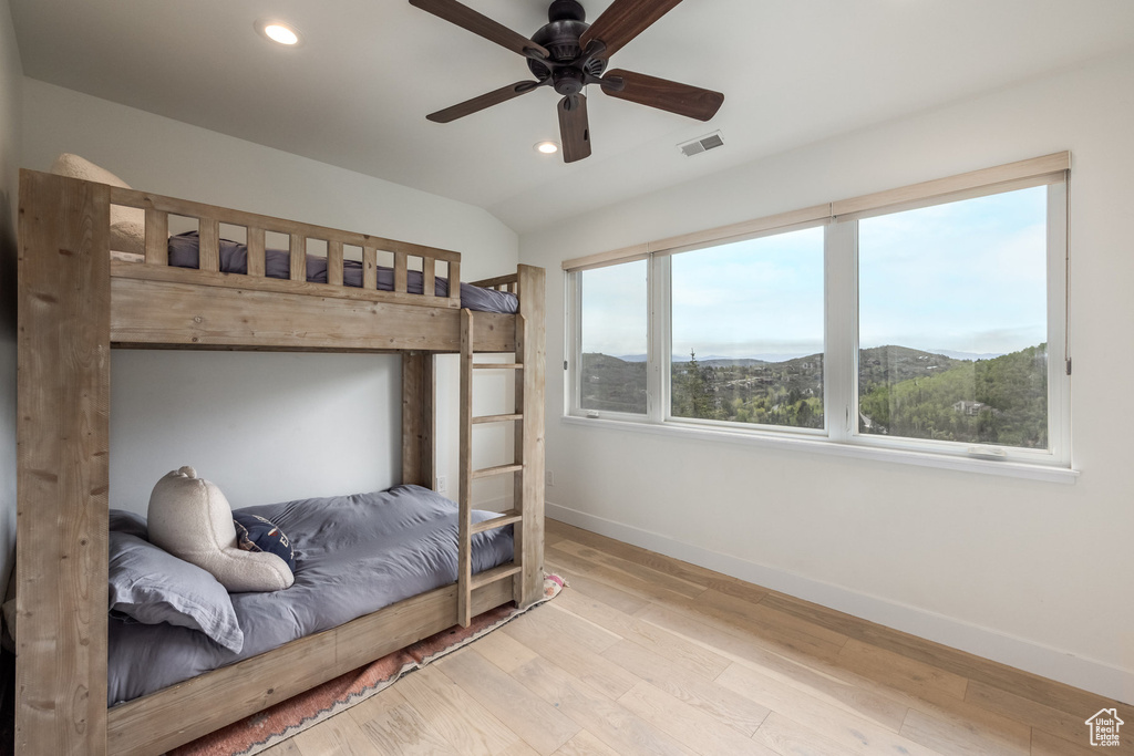 Bedroom featuring baseboards, recessed lighting, wood finished floors, and a ceiling fan