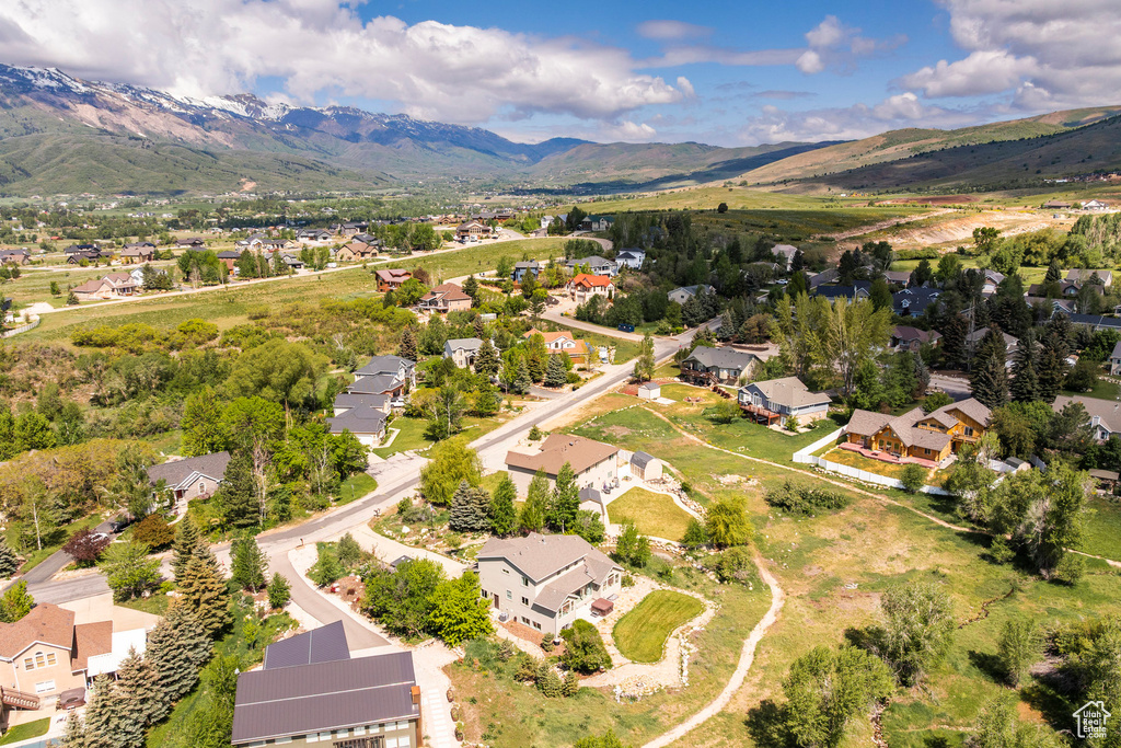 Aerial view of residential area featuring mountains