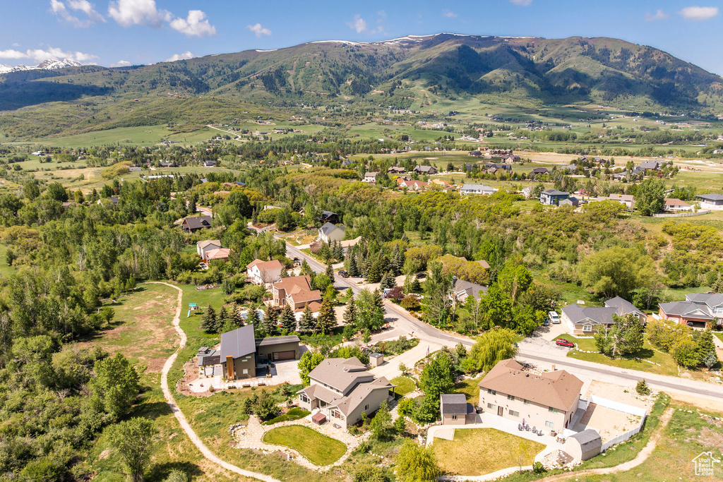 Aerial view of residential area featuring a mountainous background