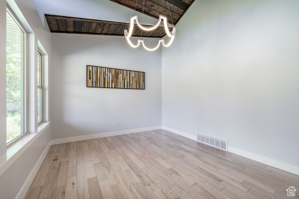 Unfurnished room featuring wood finished floors and baseboards