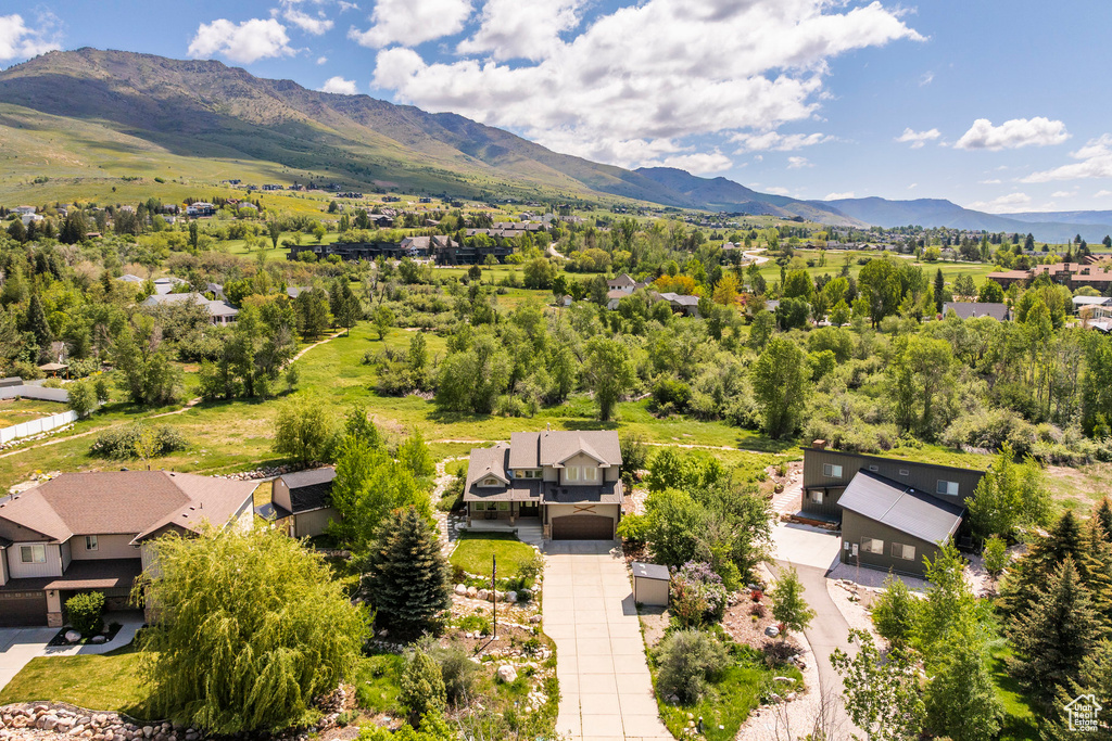 Aerial perspective of suburban area with a mountain backdrop