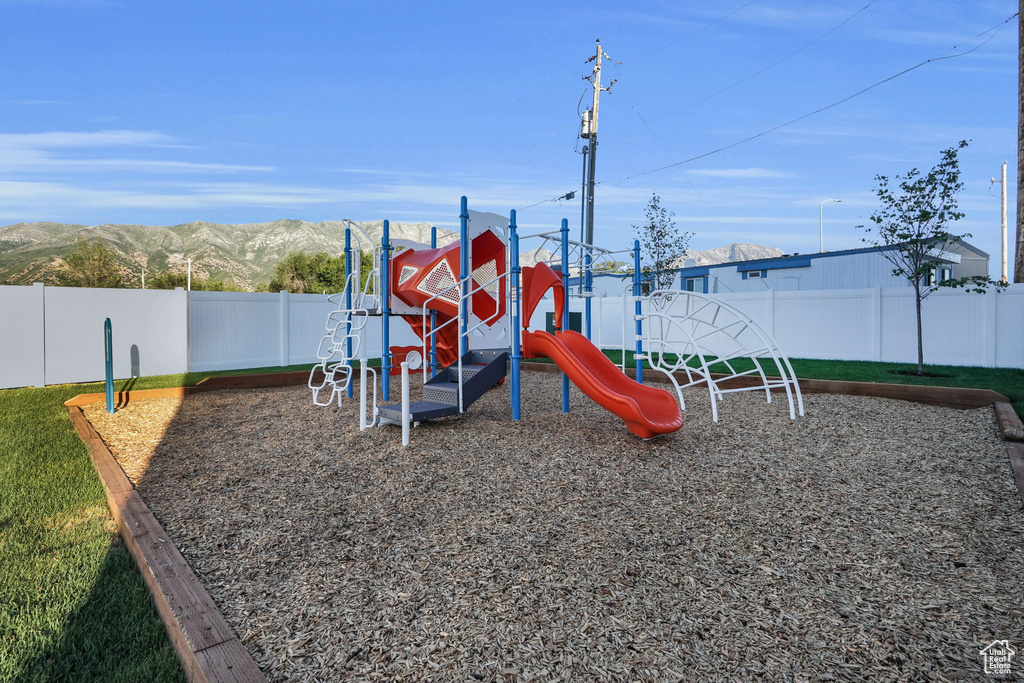 Community jungle gym with a mountain view