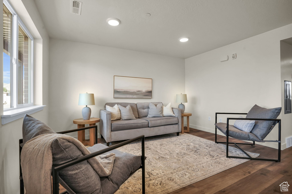 Living area featuring recessed lighting, baseboards, and wood finished floors