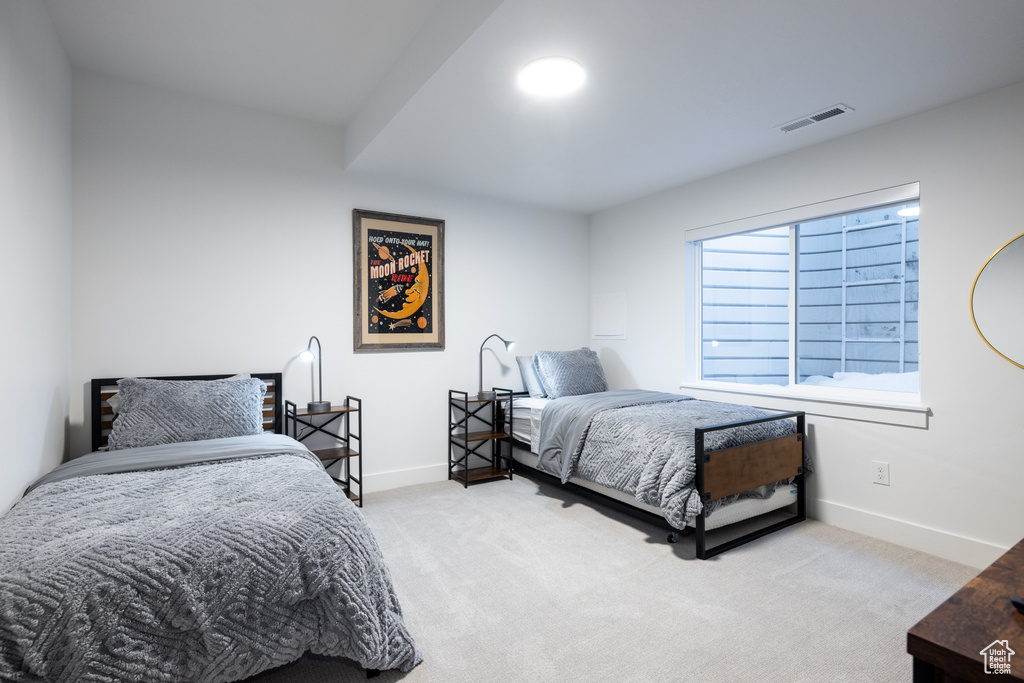 Bedroom with carpet and baseboards