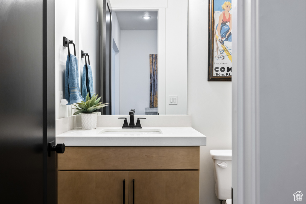 Bathroom featuring toilet and vanity