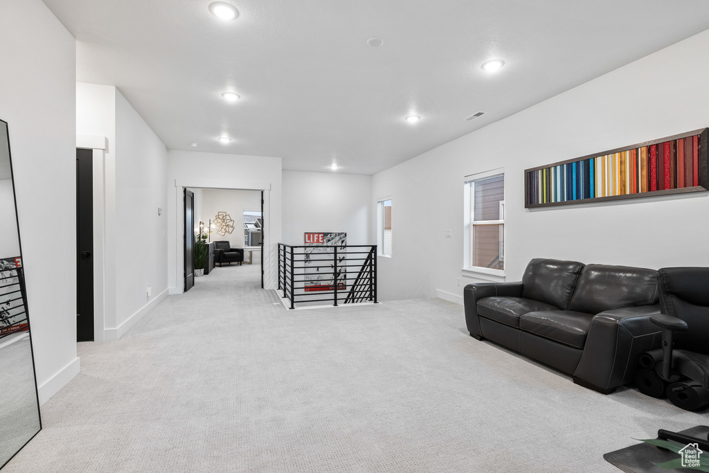 Living area featuring carpet, recessed lighting, and baseboards
