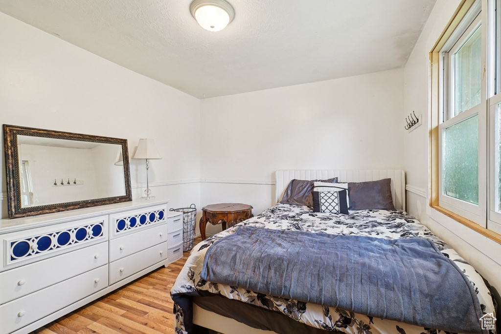 Bedroom with wood finished floors
