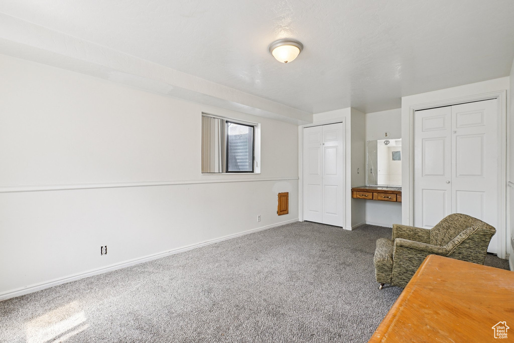 Unfurnished room with carpet and baseboards