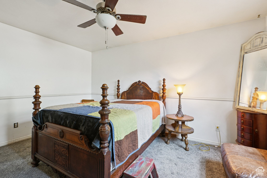 Bedroom featuring carpet, baseboards, and a ceiling fan
