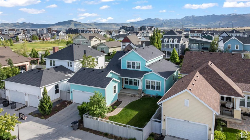 Aerial view of residential area featuring mountains