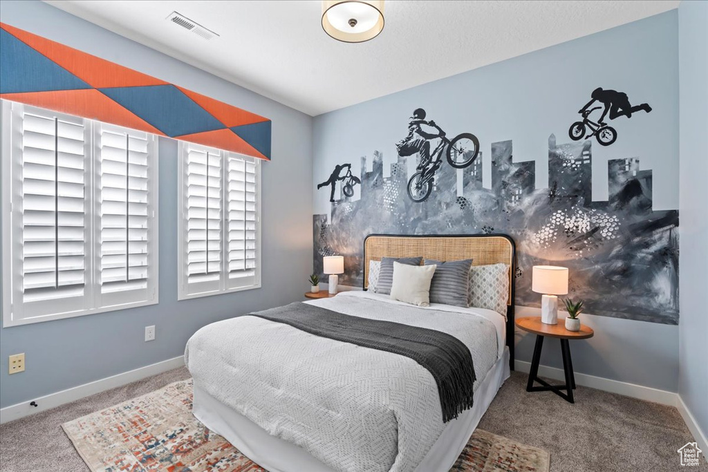 Bedroom with carpet floors and baseboards