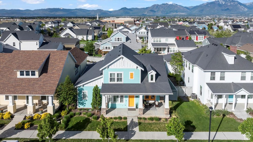 Aerial view of residential area featuring a mountain backdrop