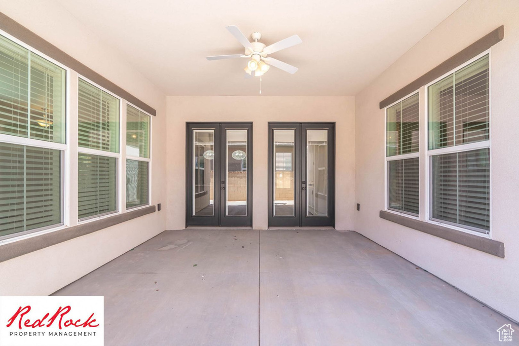 View of patio featuring french doors and ceiling fan