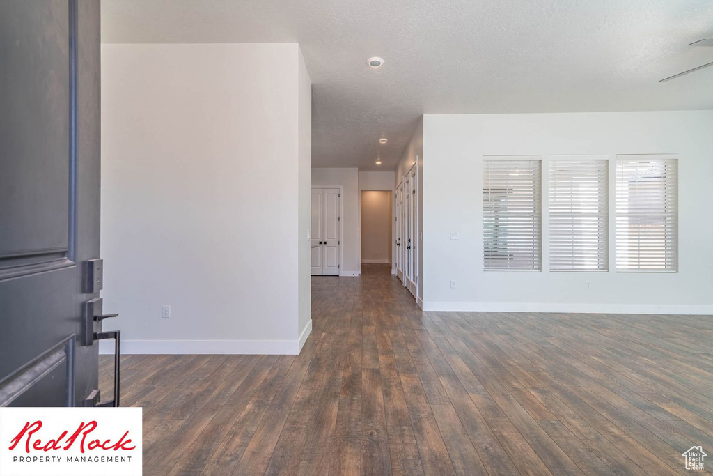 Spare room with wood finished floors and baseboards