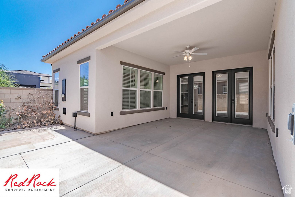 View of patio with french doors and ceiling fan