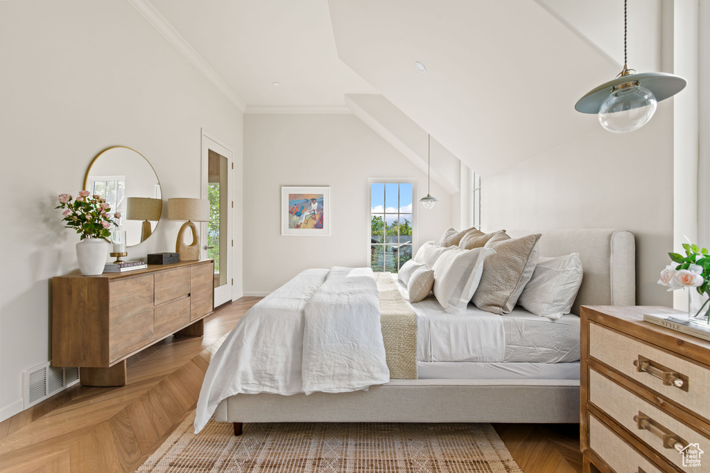 Bedroom with ornamental molding and baseboards