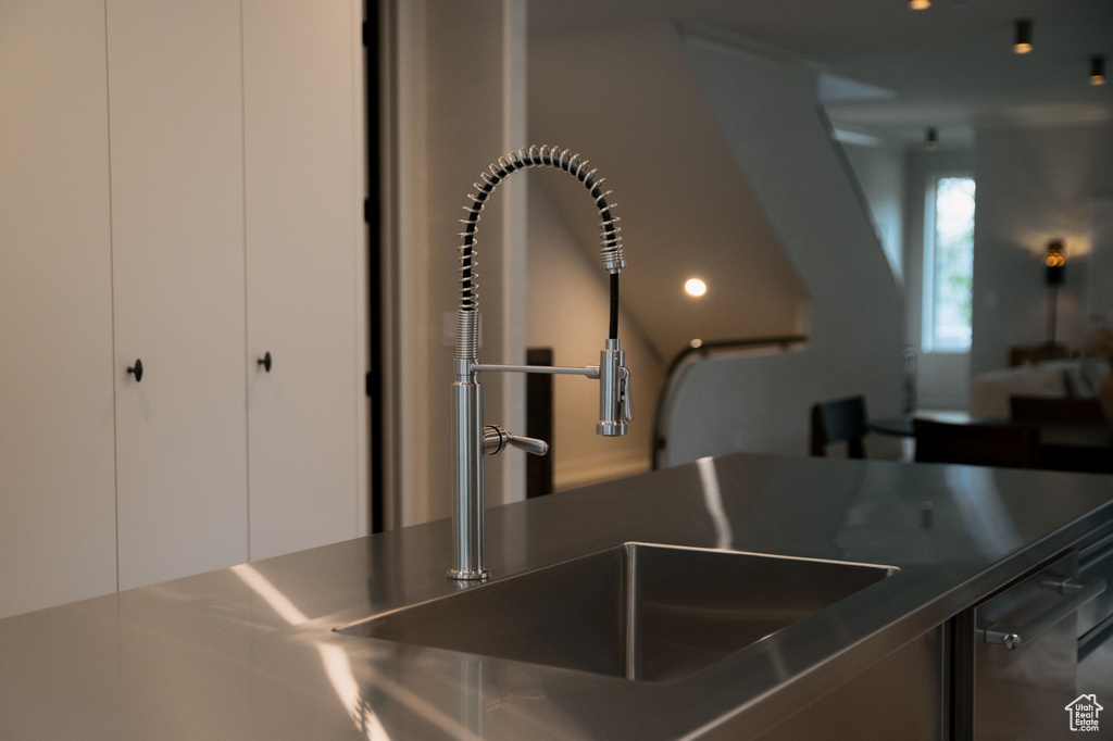 Kitchen view of stainless steel countertops and a sink
