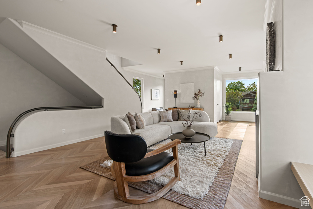Living room featuring baseboards and ornamental molding