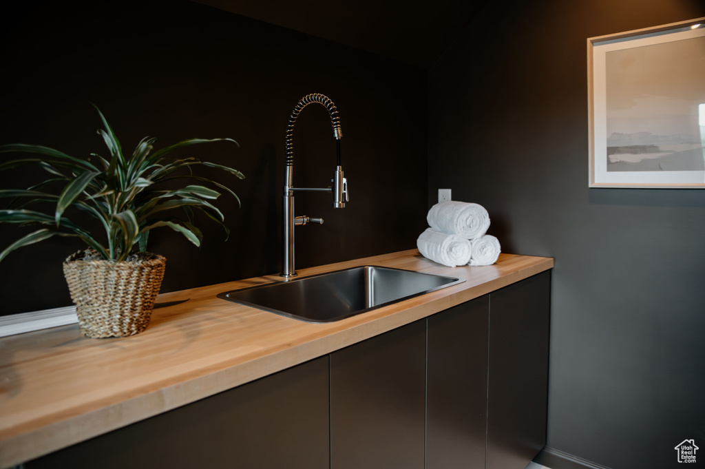 Detailed view of a sink and baseboards