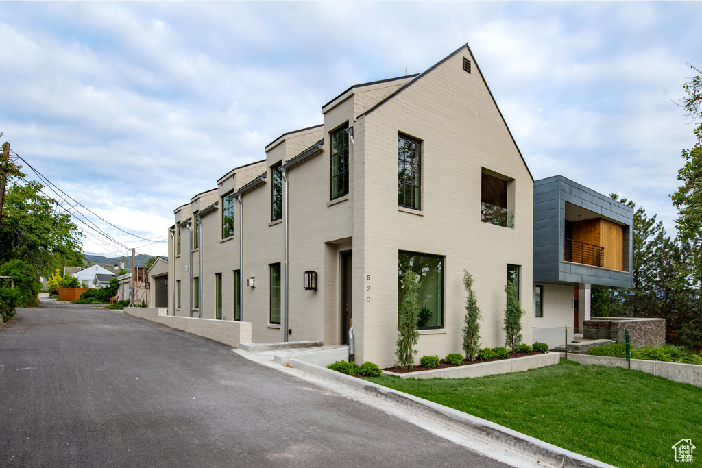 View of asphalt street with curbs