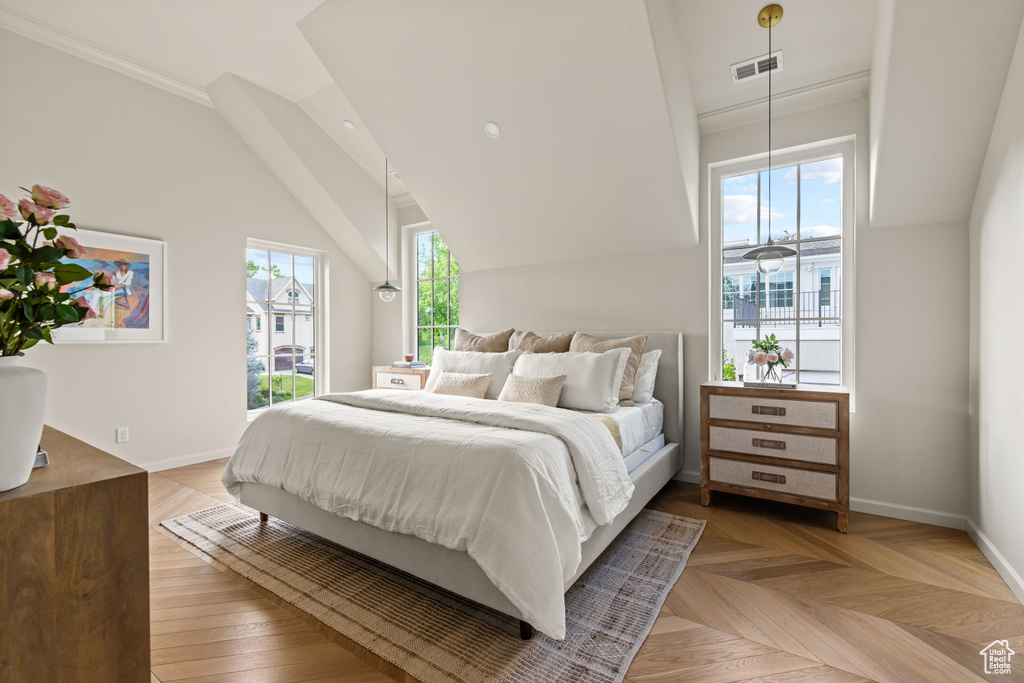 Bedroom with baseboards and lofted ceiling