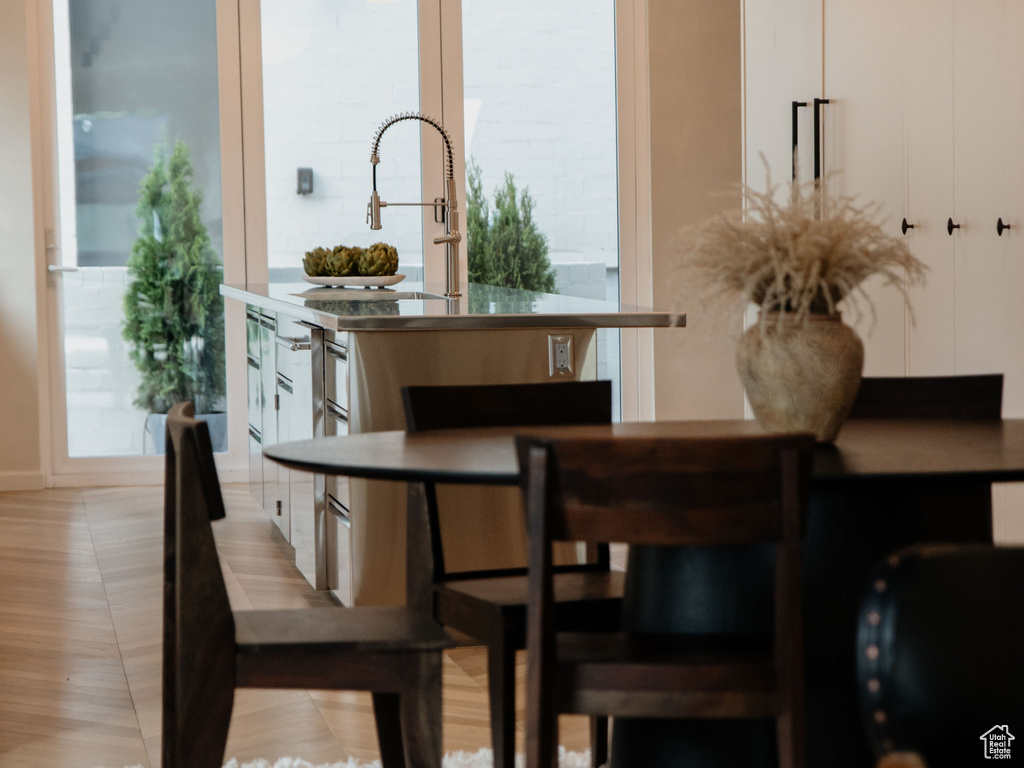 Dining room with crown molding and recessed lighting