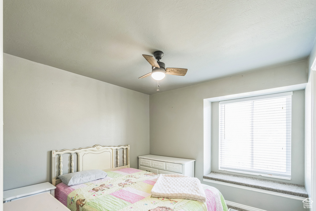 Bedroom featuring a ceiling fan