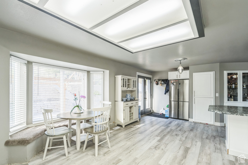 Dining space with light wood-type flooring