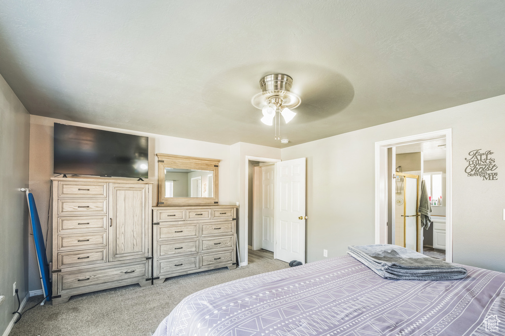 Bedroom with light carpet and ceiling fan