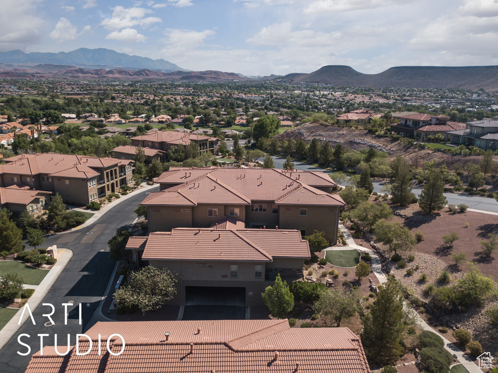 Aerial perspective of suburban area with a mountainous background