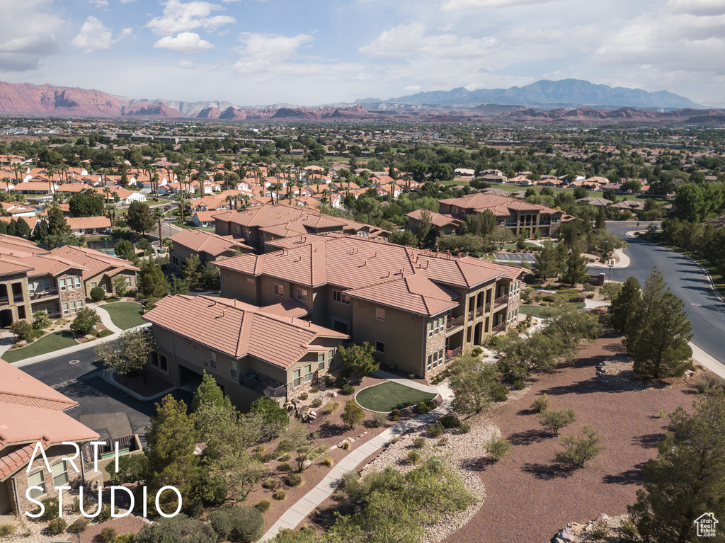 Aerial perspective of suburban area featuring a mountainous background