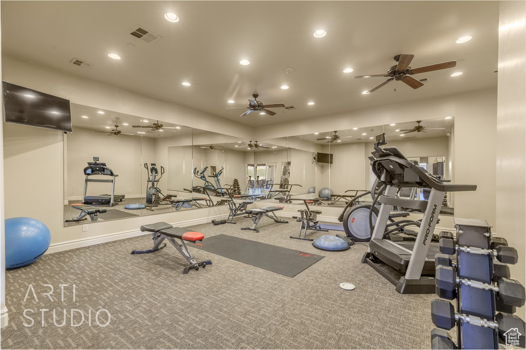 Gym featuring recessed lighting, carpet, and ceiling fan