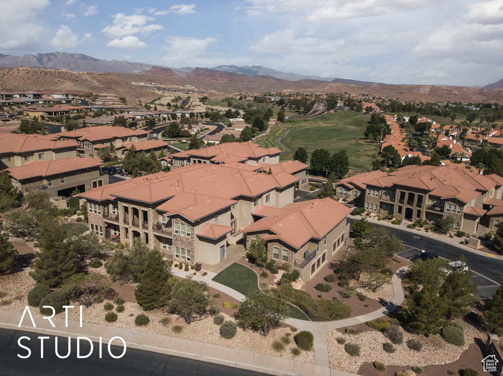 Aerial overview of property\\\\\\\'s location with a mountain backdrop and nearby suburban area