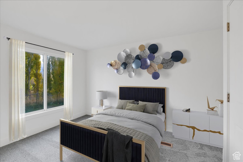 Carpeted bedroom with baseboards