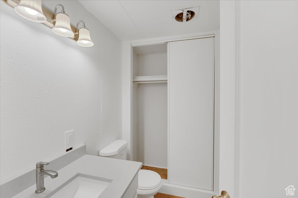 Bathroom featuring toilet and vanity