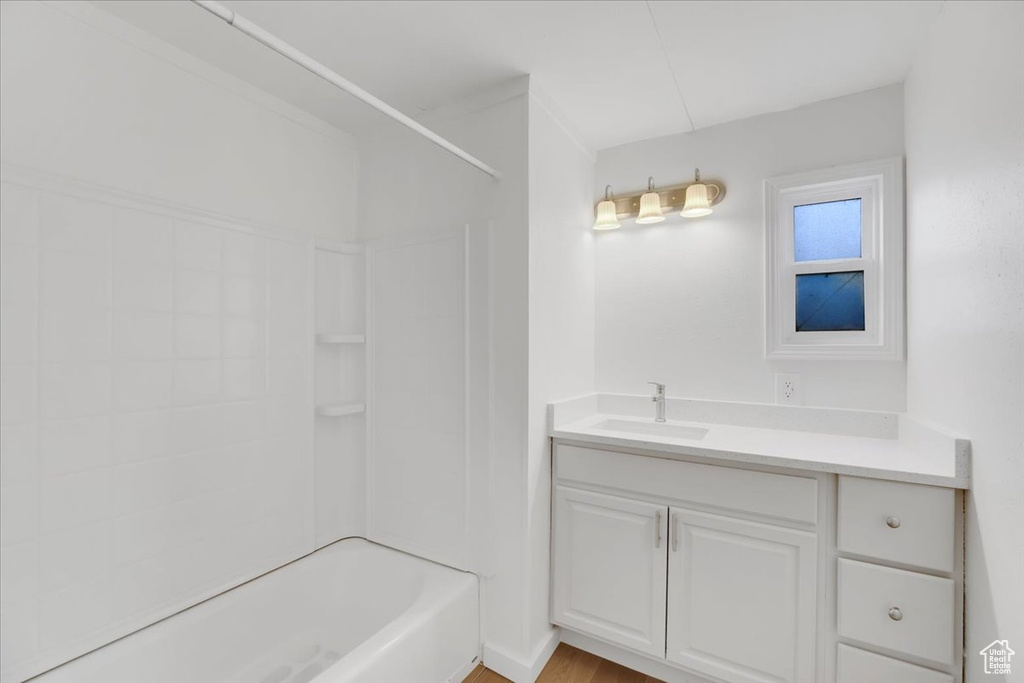 Full bathroom featuring vanity and bathing tub / shower combination
