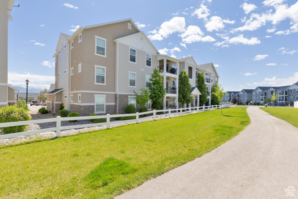 View of property with a residential view