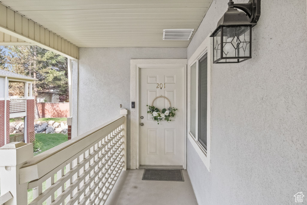 View of exterior entry featuring stucco siding