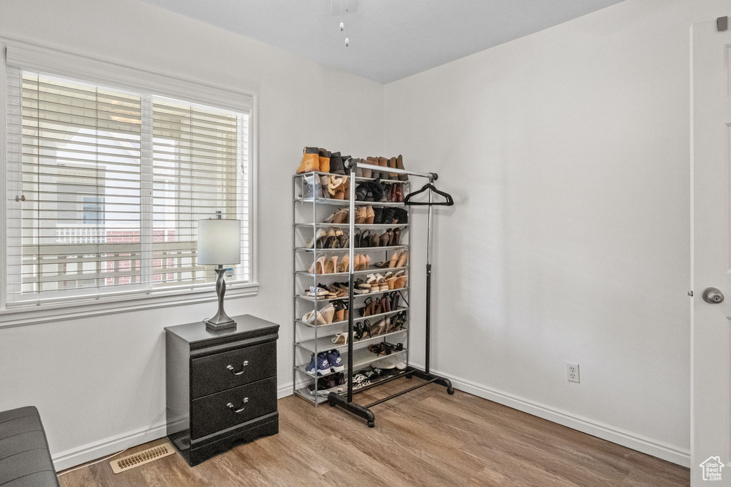 Bedroom featuring wood finished floors and baseboards
