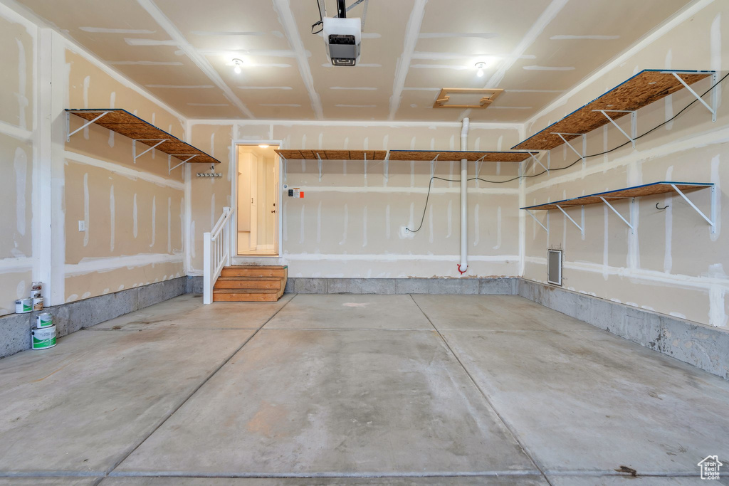 Garage featuring a garage door opener