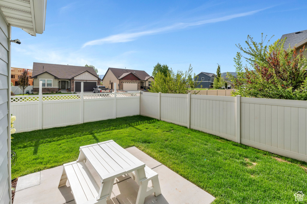 View of yard with a residential view and a patio
