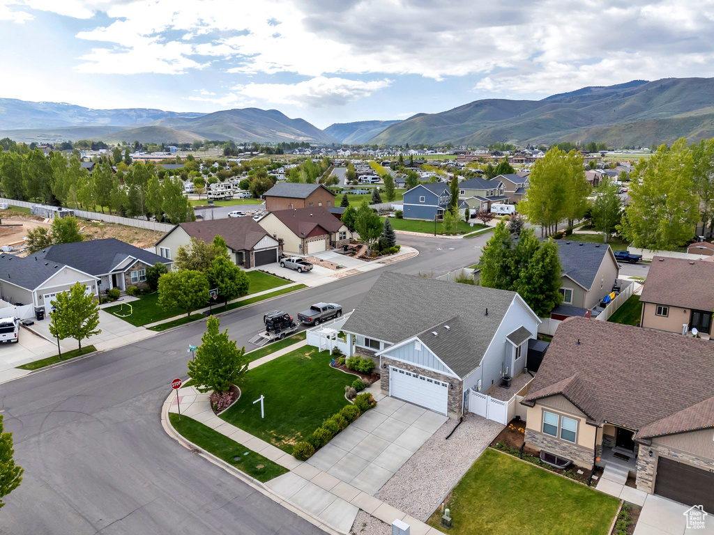 Aerial perspective of suburban area featuring a mountain backdrop