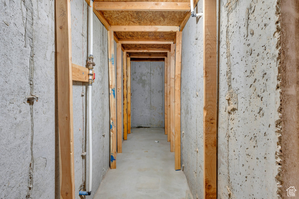 Miscellaneous room featuring unfinished concrete floors