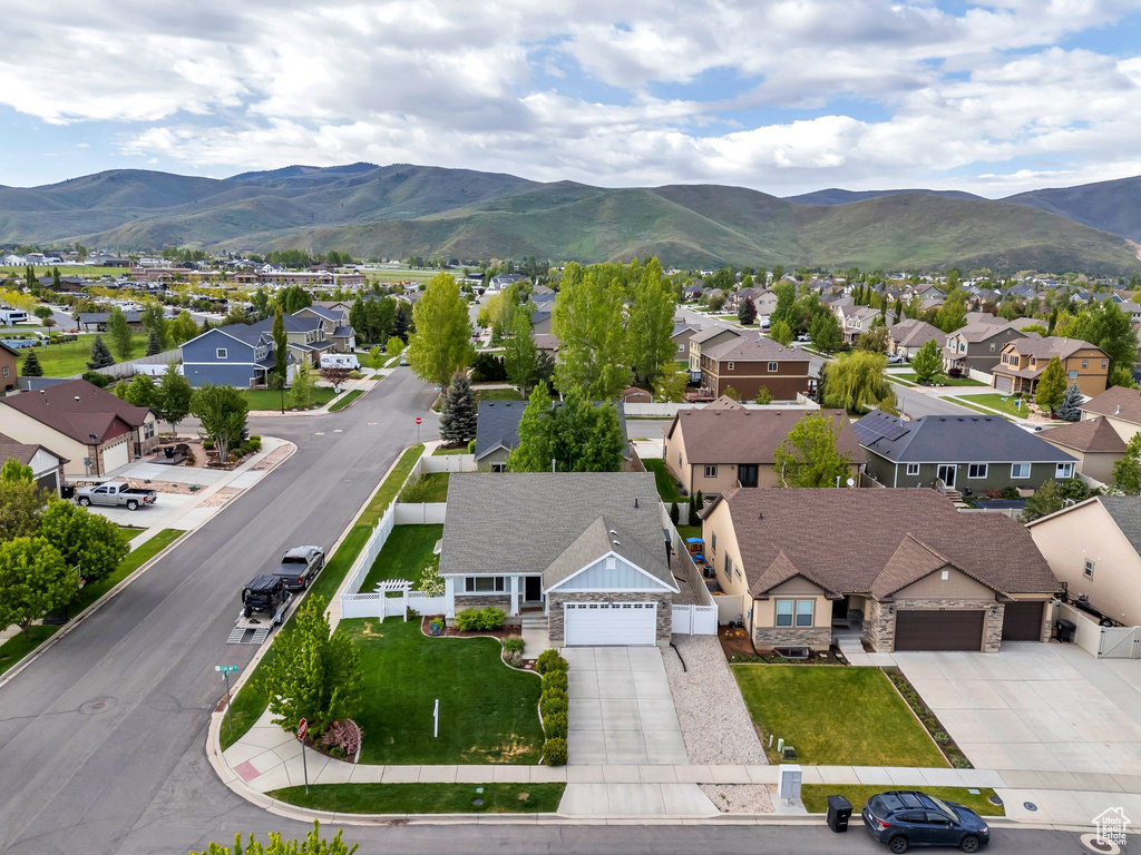 Aerial view of residential area featuring a mountain backdrop