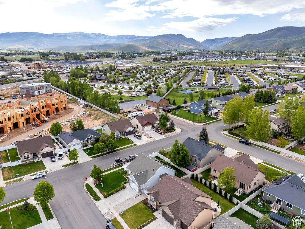 Aerial view of residential area featuring a mountainous background
