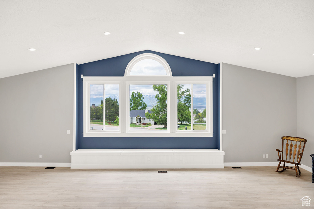 Additional living space featuring light wood-style flooring, vaulted ceiling, baseboards, and recessed lighting
