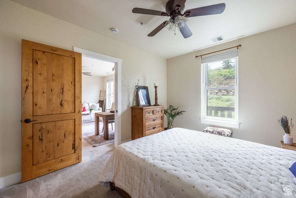 Bedroom with carpet and a ceiling fan