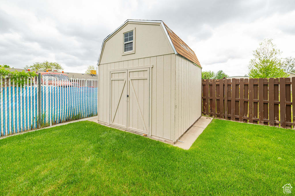 View of shed with a pool